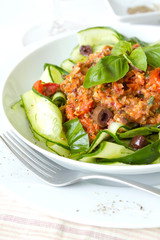 Raw Zucchini Pasta with a tomato and olive sauce