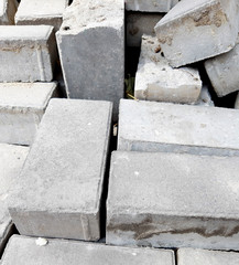 Construction Materials. Photo heap bricks. Gray texture, stone background.