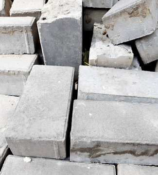 Construction Materials. Photo heap bricks. Gray texture, stone background. © polyachenkovv