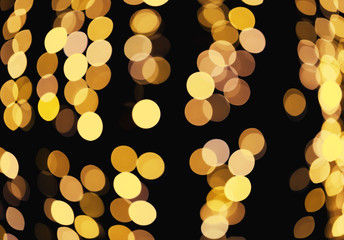 Abstract defocused glittering background. Blurry bokeh of night golden lights. Christmas and holiday concept