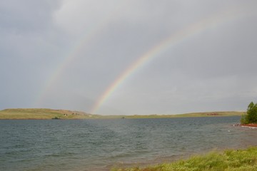 double rainbow over water