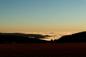 Sunset on the road with low clouds