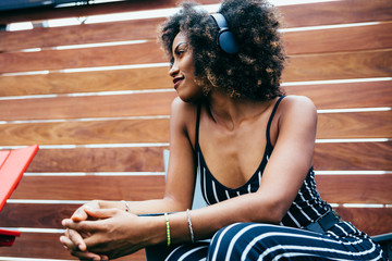 Low angle view of woman wearing headphones