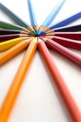 Naklejka premium Figures with colored pencils on white background