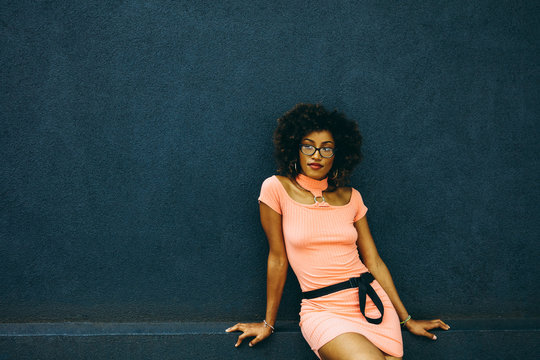 Portrait Of Woman With Natural Hair And Pink Summer Dress