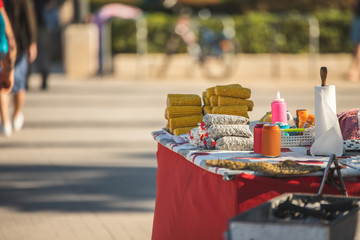food vendors on the beach, ethnic food as a business profile, corn and vegetables prepared on the grill