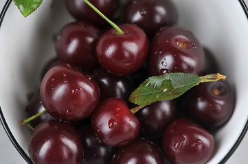 Ripe berries of a sweet cherry close up. Light background. Мacro photography.