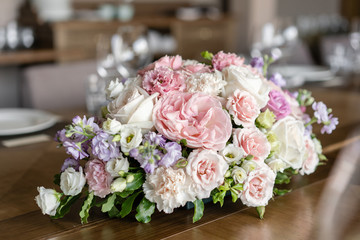 Wine glasses in the foreground. Wedding Banquet or gala dinner. The chairs and table for guests, served with cutlery and crockery.