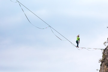 Highliner balances over the abyss.