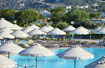 Sun umbrellas in the pool area. Rhodes, Greece