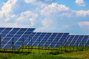 Solar panels with the sunny sky. Blue solar panels, background of photovoltaic modules for renewable energy.
