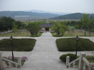 Beautiful landscape in South Korea. Park with green lawns and trees go into the mountains and grow into the mountains