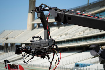 Event video camera on crane live football mach or concert.