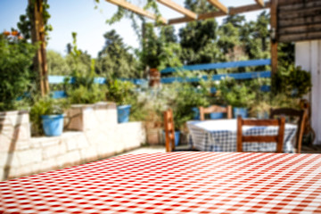 Wooden table backgruond with nature in distance. Blurred garden view.  Forest view in background.