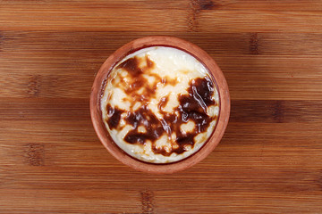 the Delicious Turkish cuisine sutlac on a wooden table from the high angle