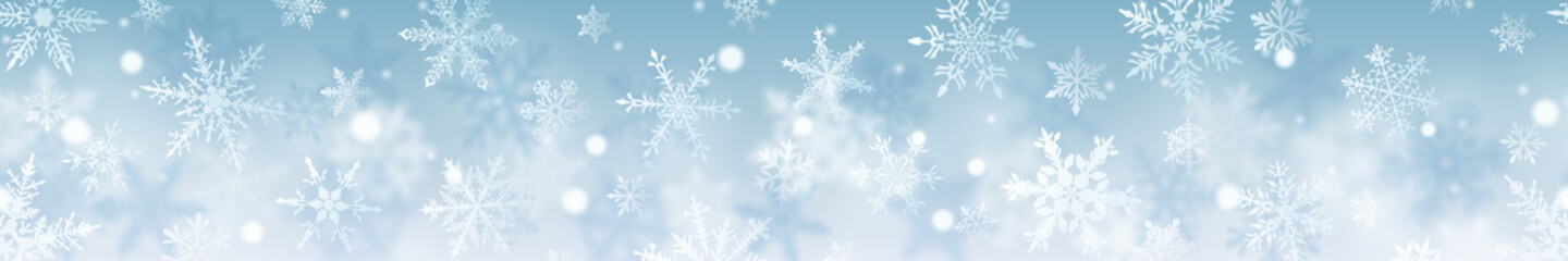 Fototapeta na wymiar Christmas banner of complex blurred and clear snowflakes in white colors on light blue background. With horizontal repetition