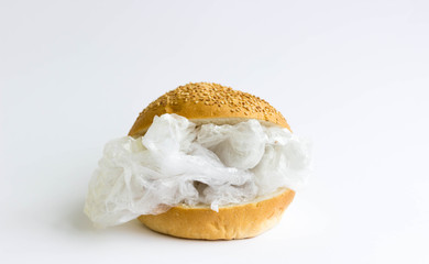 Bun with polyethylene and plastic instead of vegetables and meat. The problem of pollution of the...