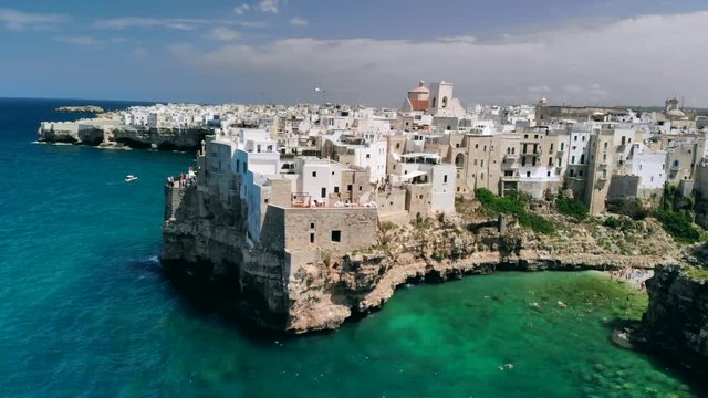 Aerial View of sea from Polignano a Mare and beach with tourists, Puglia, Italy