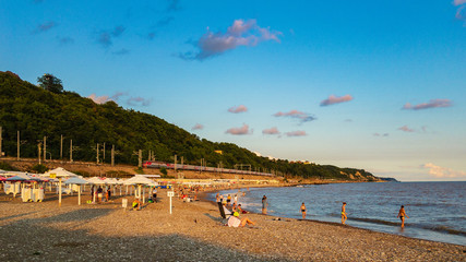 Beach on the Black Sea coast with a rest at sunset summer sun.