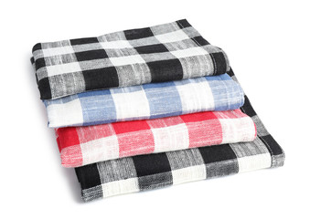 Folded checkered kitchen towels on white background