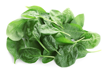 Heap of fresh green healthy baby spinach leaves isolated on white, top view