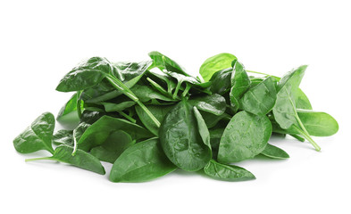 Heap of fresh green healthy baby spinach leaves isolated on white