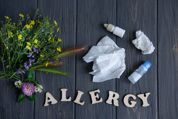 Conceptual photo with wildflowers, nose drops and shawls. Allergy. Allergy drops. Seasonal allergy...