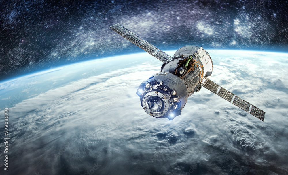 Aufkleber cargo spacecraft in the space near earth planet. nebula and stars. spaceship. elements of this image
