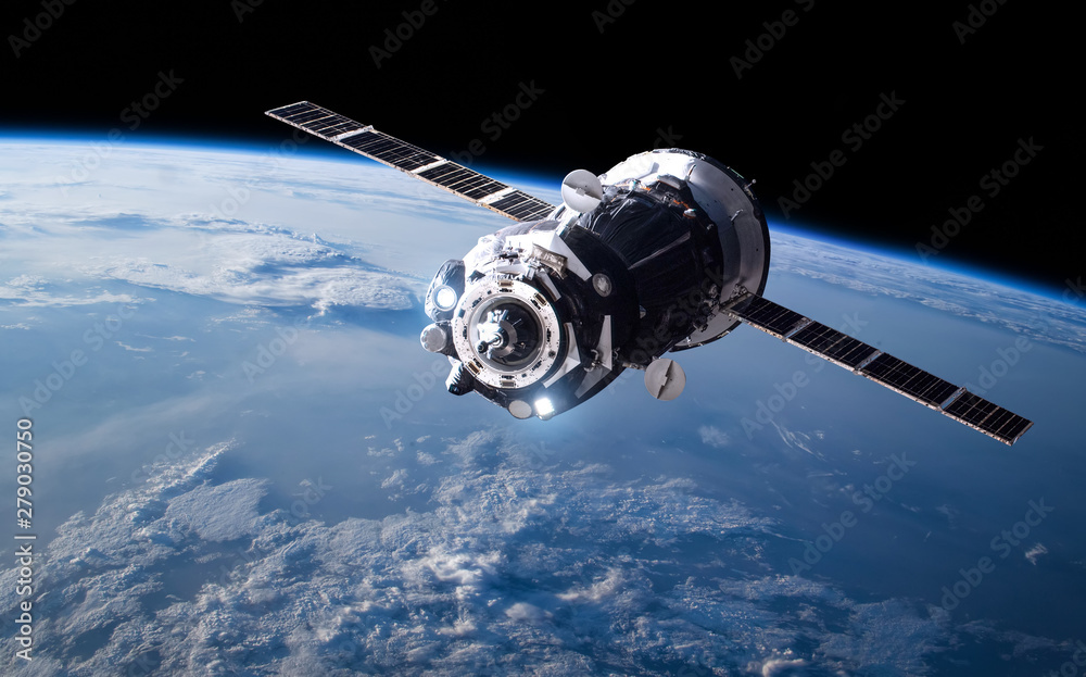 Poster cargo space ship on orbit of the earth planet. milky way on background. elements of this image furni