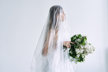 bride in white dress with bouquet of flowers