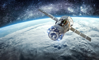 Cargo spacecraft in the space near Earth planet. Nebula and stars. Spaceship. Elements of this...