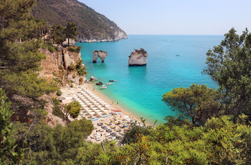 Summer touristic destination in Puglia, Italy: Faraglioni di Puglia Baia delle Zagare. Travel Italy.