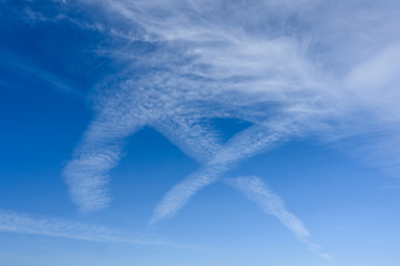 Beautiful clouds in the shape of roman number nine on deep blue sky