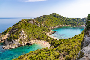 Famous two side Porto Timoni beach near Agios Georgios. Crystal clear azure water. Corfu, Greece