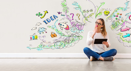 Many thoughts with young woman holding a tablet computer