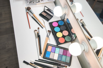 Beauty tools palettes collection. Brush on white table