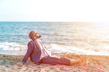 Successful businessman relax on the beach