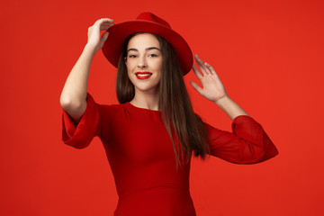 portrait of young woman in red hat