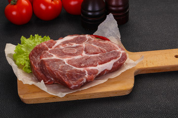 Raw pork neck steak