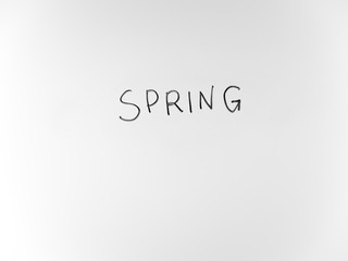 written in marker by hand text spring