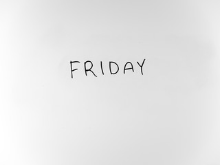 written in marker by hand text friday