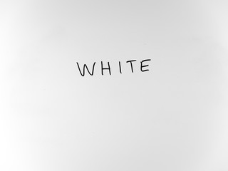 written in marker by hand text white
