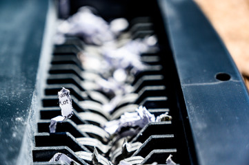 closeup view of office paper shredder teeth 
