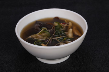 Thai style soup with meat and mushrooms