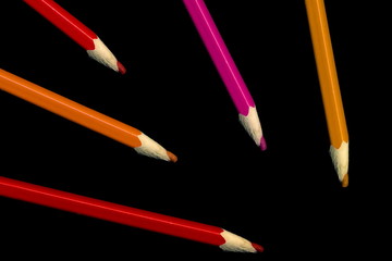 Old colored pencils lying on a black background - 279034320