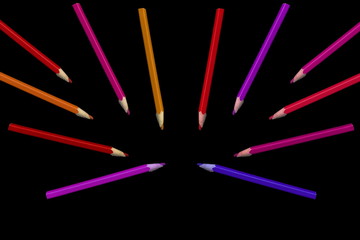 Old colored pencils lying on a black background - 279034327