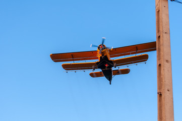 View on an old plane flying againtst the blue sky