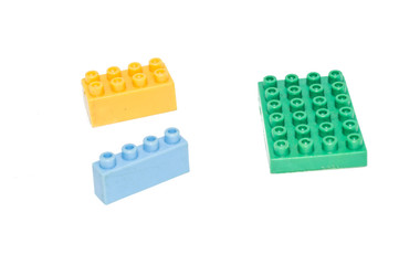 children's toy - building blocks in plastic color bricks, isolated on white background