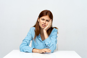 portrait of young woman sitting on sofa