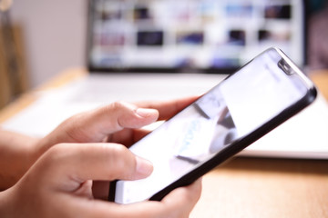 Businessman Holding and Using Smart Phone